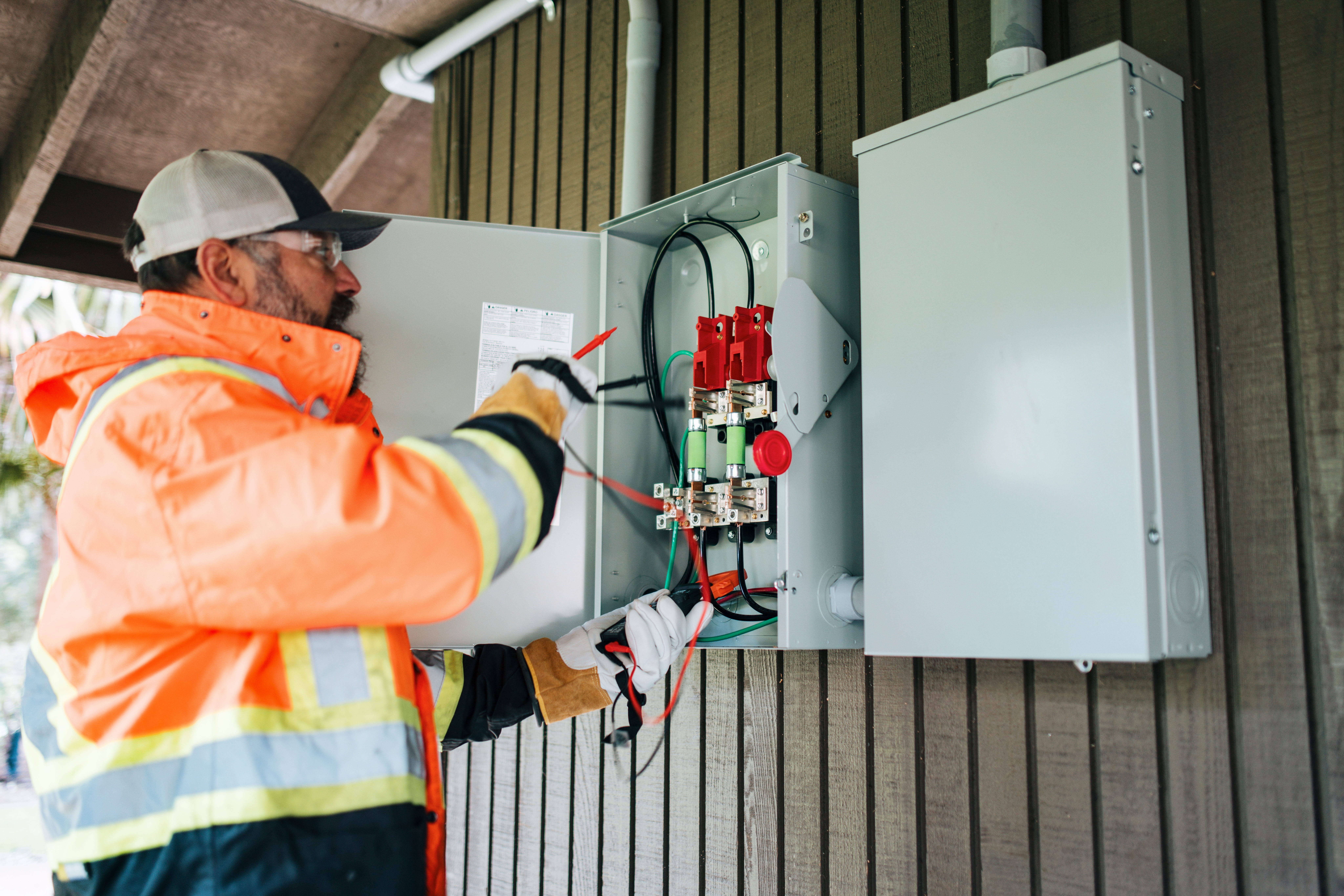 Electrical professional testing equipment near an electrical cabinet