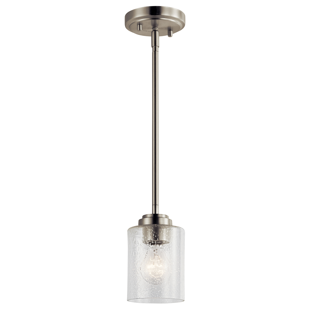 The Winslow 7in; 1 light mini pendant features a classic look with its Brushed Nickel finish and clear seeded glass. Winslow mini pendant is perfect in several aesthetic environments, including traditional and transitional.