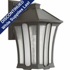 Featuring an updated bungalow design style, Twain's large wall lantern offers visual interest for a variety of home exteriors. Seeded glass panels with center glass panel frosted to soften appearance of light and is finished in an Antique Bronze. Open bottom design allows easy access to replace lamps.