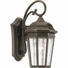 The one-light small wall lantern in the Verdae collection offers traditional styling for a variety of exteriors. Classic and formal clear seeded glass complements an Antique Bronze finish. Open bottom design allows easy access to replace lamps. Antique Bronze finish.