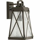 A cottage-inspired outdoor medium wall lantern with a tapered cage. Creighton features clear water glass clear and Antique Bronze finish. The frame's linear details are riveted to enhance mechanical detailing of the fixture. Wall, post and hanging lantern options available. Antique Bronze finish.