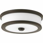 Featuring a sleek and slim appearance, Bezel LED is an architectural series of flush mount options. Etched white glass is accented by a metal trim in a metallic finish. The glass shade is illuminated on both the bottom and sides to provide a pleasing lighted effect. 10 in LED Flush Mount. Antique Bronze finish.