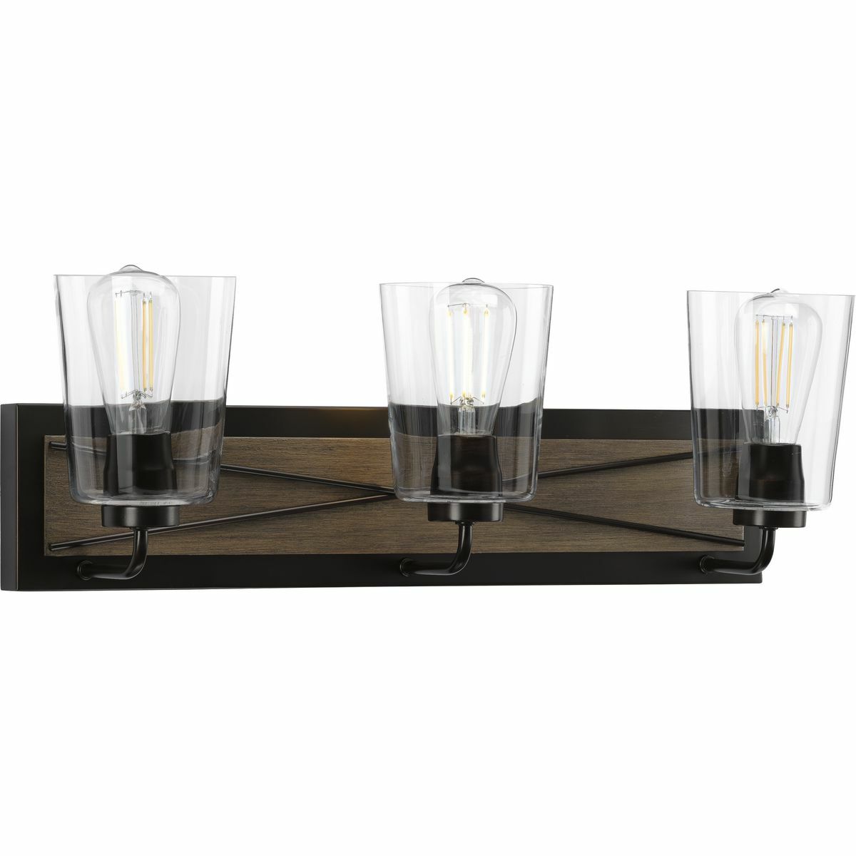 Embed a touch of country character into farmhouse and rustic interiors with the barndoor-inspired X-brace design of the Briarwood three-light bath. A trio of clear glass shades are held by curved arms. A rectangular, Antique Bronze backplate proudly displays the X-brace pattern highlighted by a decorative backdrop of faux wood, making it a must-have for a bathroom mirror, in a hallway, or wherever focused light is desired.