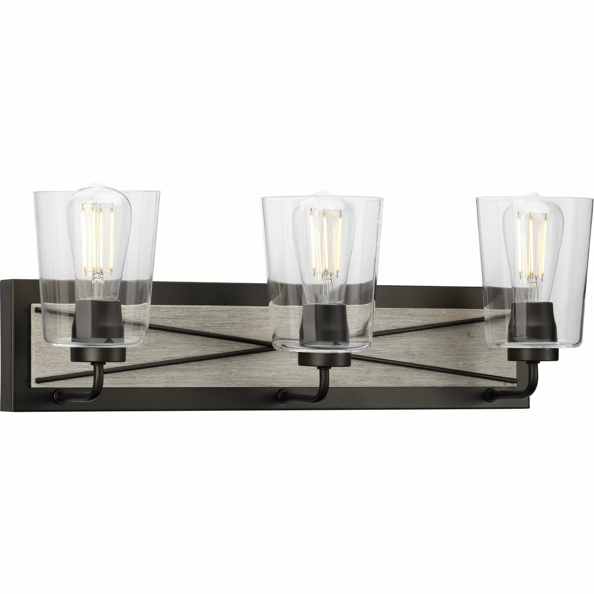With a nod to its farmhouse roots, the Briarwood three-light bath offers a triad clear glass shades attached to a Graphite-finished backplate. The X-brace design takes center stage atop a painted light, white-washed, faux wood, rectangular shape, giving the fixture a back country feels making it a suitable choice for bathrooms and hallways in rustic and farmhouse settings.