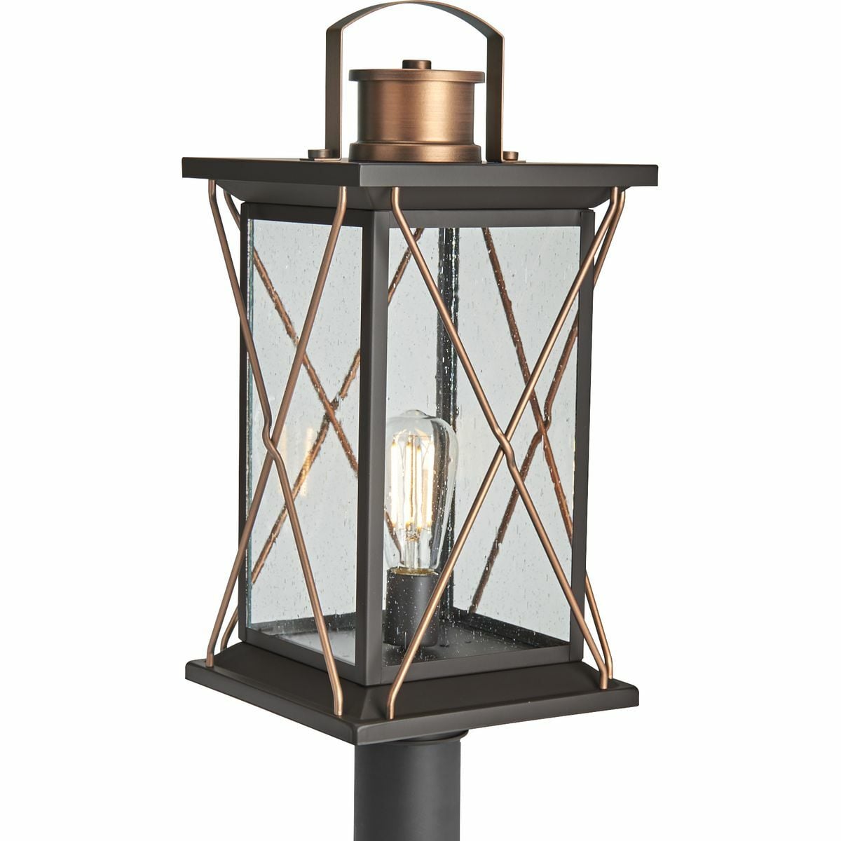 Transform your home into a warm and cozy dream with the friendly farmhouse-style of this post lantern. A rustic X-brace design decorates each side of the charming lantern silhouette. Clear seeded glass panes add an extra pop of rustic personality. An antique bronze finish complemented with antique copper accents adds warmth and character as the lantern infuses your home with gentle illumination.