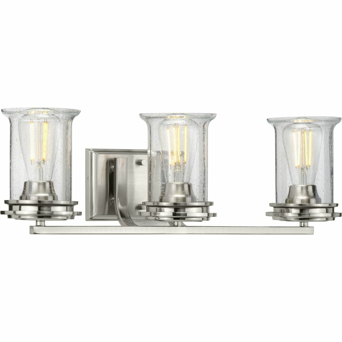 Immerse yourself in a home atmosphere primed for relaxation and inspired thinking with the beautiful craftsmanship of this bath light from the Winslett Collection. Savor this fresh take on a classic light choice as your gaze traces graceful arms and clean crisp lines coated in a beautiful brushed nickel finish. Lightly seeded glass shades rest in shiny pedestal light bases that add an unexpected, but welcomed dash of modern personality to this clean, traditional design.