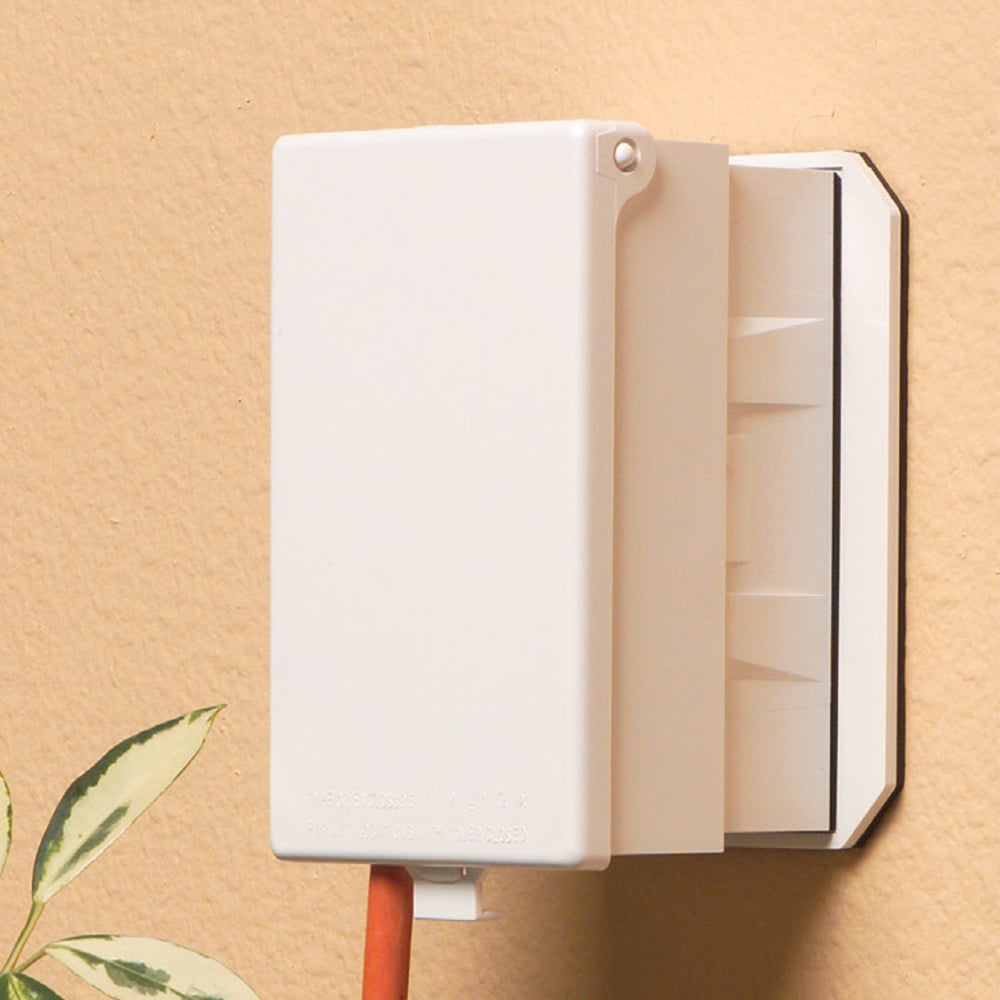 1 Gang Low Profile, IN and OUT cover for new and existing construction. Weatherproof in-use. Meets extra-duty code requirements when cord is plugged in. UV rated plastic. Vertical. Color - White. Paintable. Has an installed oversized base for large openings or a 3-1/2" round outlet box.