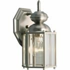 Brighten your outdoor space with style using this wall lantern. Featuring a classic design completed with clear beveled glass panels for ample lighting, this lamp boasts a beautiful brass finish for an appealing look. Solid brass wall lantern with clear beveled glass panels and an open bottom. Brushed Nickel finish.