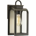 One-light small wall lantern in a Cape Cod-inspired frame pays homage to a classic nautical style. Light output and geometric forms offer visual interest to outdoor exteriors. Clear glass windows are paired with a unique umber reflector panel that provides a beautiful effect when illuminated.