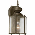 Solid one-light 5-3/4 in small wall lantern in rich weathered finish is complemented by seeded glass panels - a great choice for low maintenance and years of enjoyment. Antique Bronze finish.