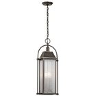 This 4 light outdoor pendant from the Harbor Row(TM) collection has an updated traditional design inspired by classic carriage lanterns, featuring a clear, seeded glass for a highly textured appearance and brass candle accents for a warm glow.