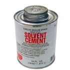 1/2 Pint standard gray PVC cement with dauber applicator.